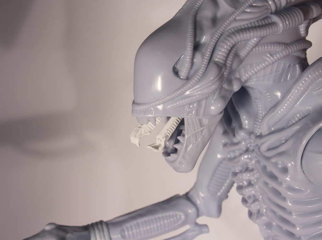 The Alien Warrior measures 18-inches and matches the features of the original 1979 Kenner Alien. It is articulated at the hips, shoulders, wrists, and tail, and has the same spring-loaded jaw mechanism to release the horrifying inner jaws, operated with a trigger on the back of the head. The figure can also hang from its tail just like the original. 